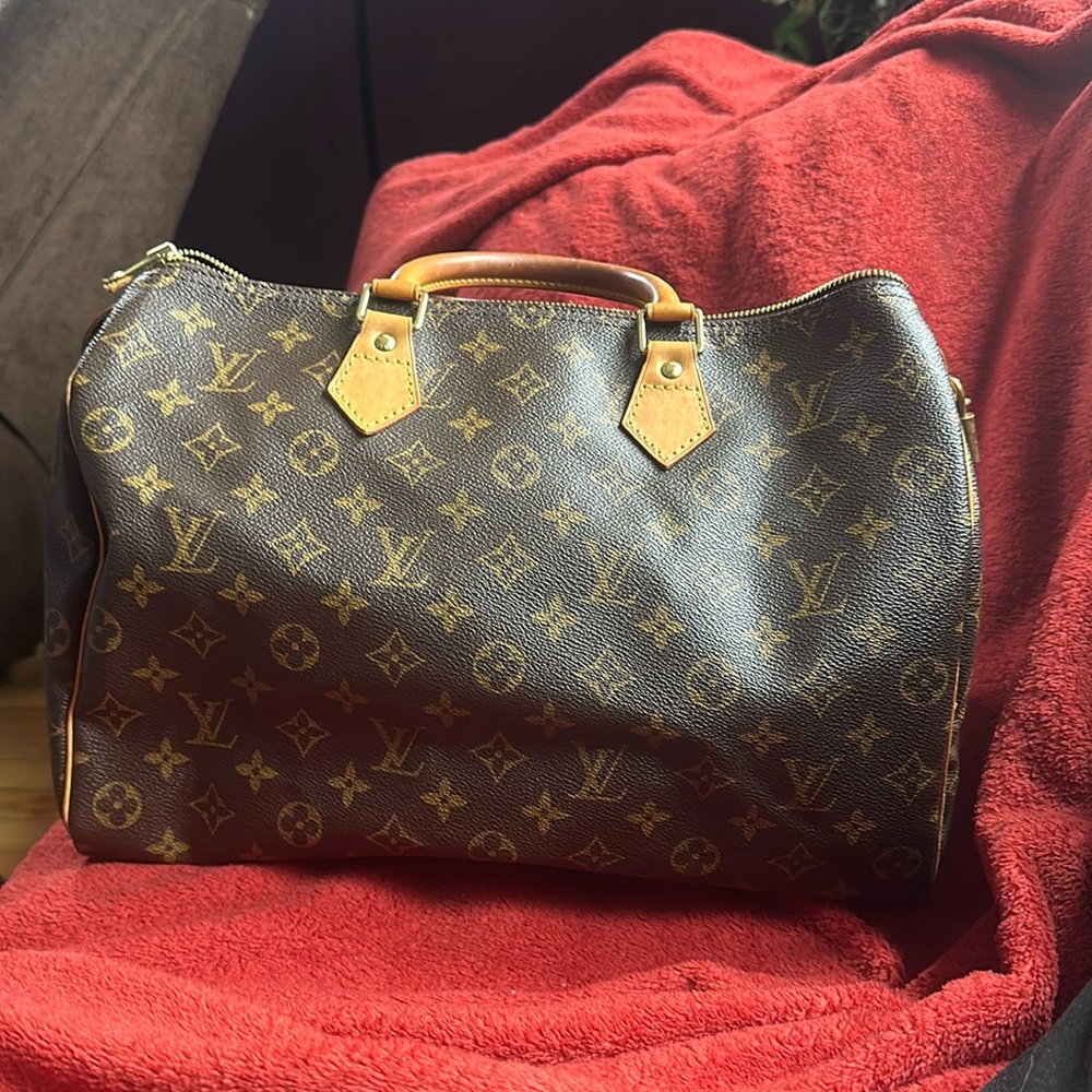 Louis Vuitton Speedy 35. H 9in. W 6in L 14 in